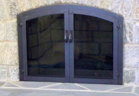 Osterville Arch All flat black finish, twin door with standard forged handles smoke glass, no mesh, no draft panel.  (Mortar installation)